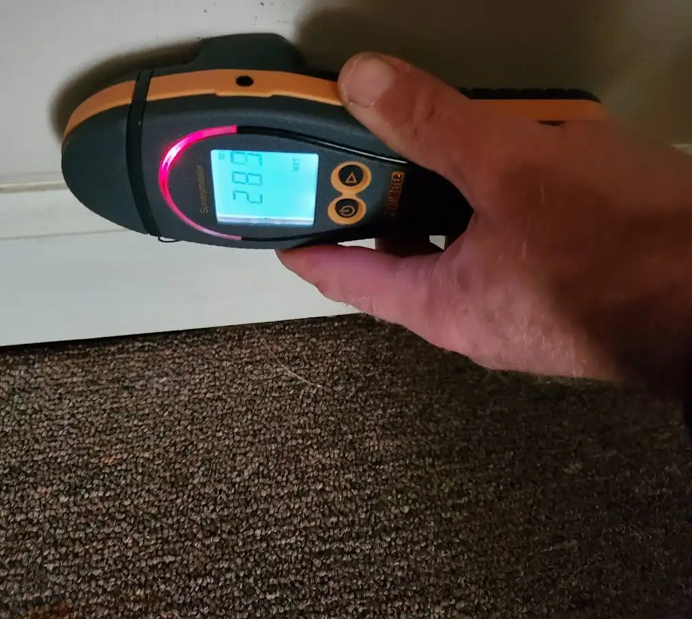 Moisture detection at baseboard during Storm Damage Restoration in Cleveland